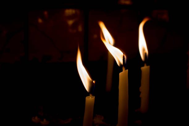 istock Burning candles give light in the dark 906385238