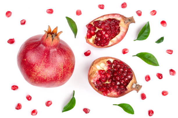 istock pomegranate with leaves isolated on white background. Top view. Flat lay pattern 906390254