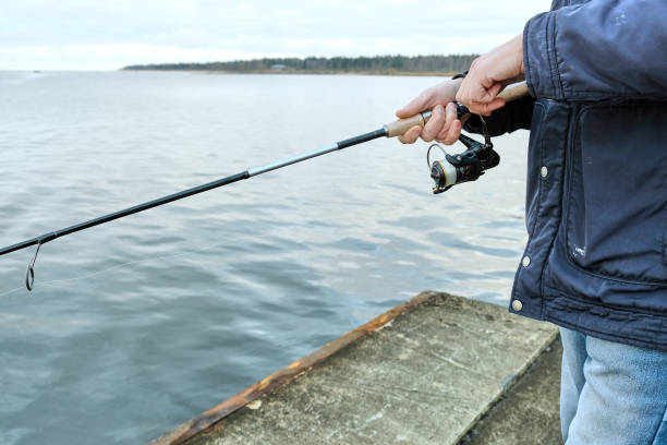 istock fishermen catch fish on the pier 906392954