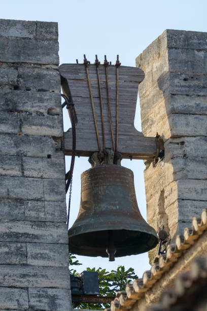 istock Big bell on the old stone fortress wall 906395858