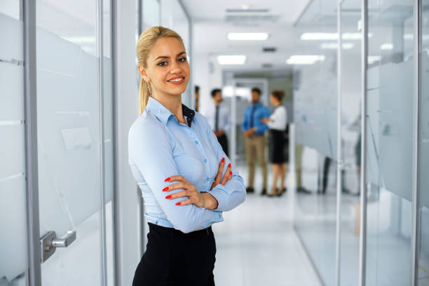 istock Young businesswoman posing in hallway 906396278