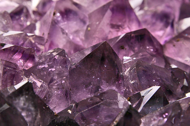 A purple amethyst crystal close-up stock photo