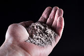 People hand holding gray ash