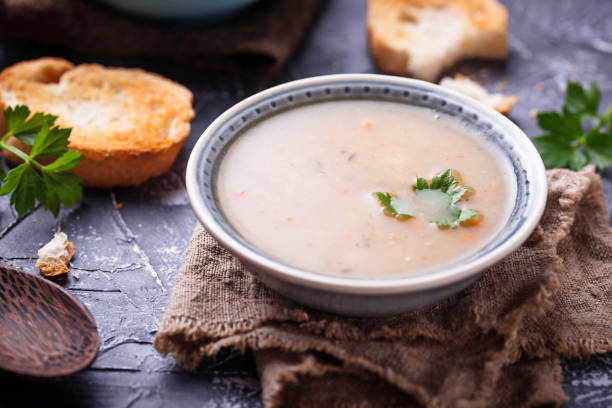 istock Healthy vegetarian peas soup on concrete background 906403018