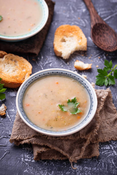 istock Healthy vegetarian peas soup on concrete background 906405114