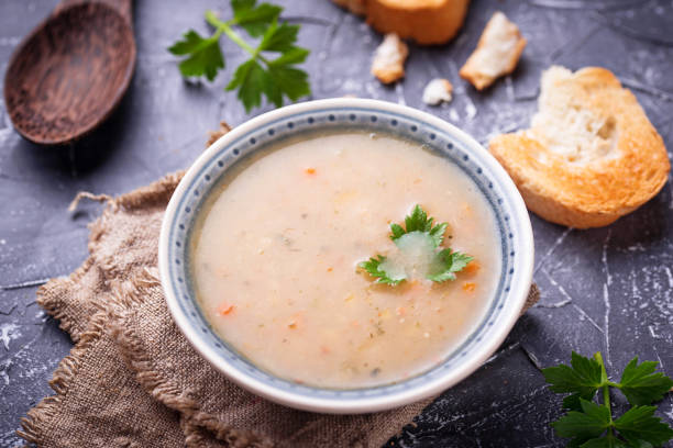 istock Healthy vegetarian peas soup on concrete background 906407662