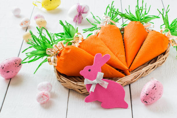 istock Handmade package for Easter sweet gift in form of carrots 906414388