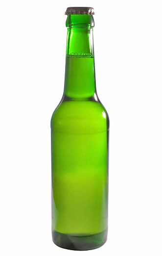 glass of beer and bottles with no logo on wooden table isolated copy space, glass bottle