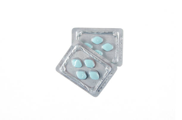 istock two plates of green pills on white isolated background 906419916
