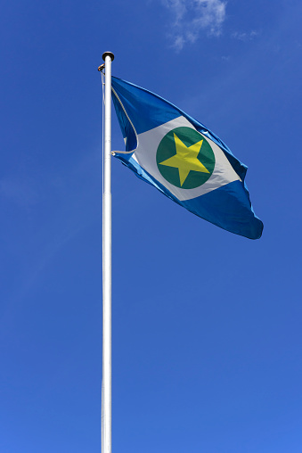 Flag of the State of Mato Grosso in midwest region Brazil, hoisted on a mast