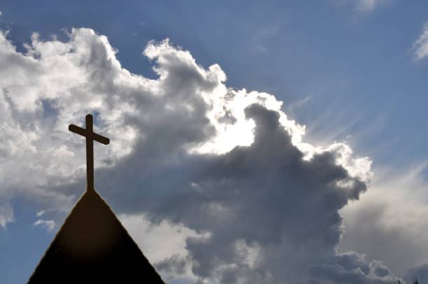 istock Church steeple silhouette, clouds, sunrise with copy space 906465244