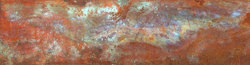 A colourful patina on a strip of copper
