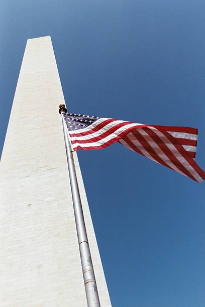 istock Washington Monument and American Flag 90649573