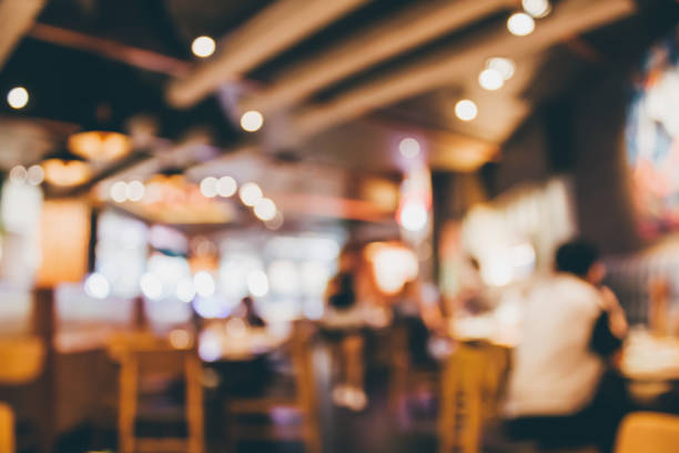 istock Restaurant cafe or coffee shop interior with people abstract blur background 906495896