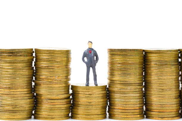istock Figure miniature businessman or small people standing on first step of coin stack and look at the top of coin on white background for money and financial business concept. 906495976