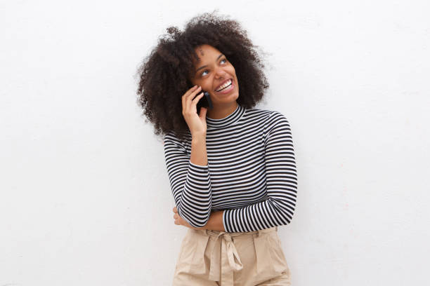 istock Happy black woman talking on mobile phone 906496248
