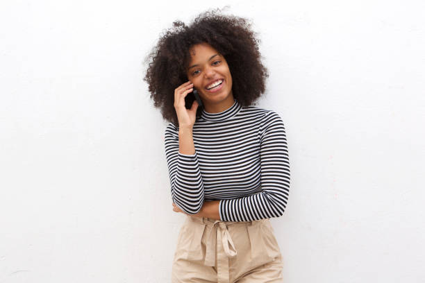 istock Happy black woman talking on smart phone 906496252