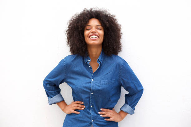 istock Happy friendly woman smiling on isolated white background 906496354