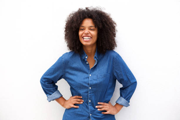 istock friendly woman smiling on isolated white background 906496364
