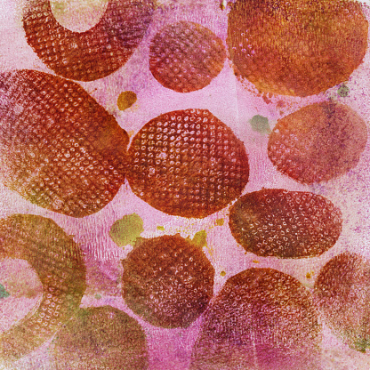 A hand painted mottled background. The prominent colors are shades of red and pink. There is a texture throughout the painting with circles.