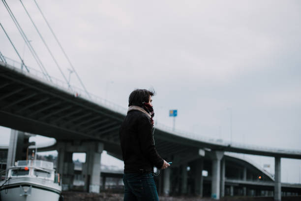 istock Man relaxing outdoors in the city 906504176
