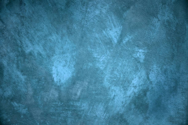 istock Old stucco plaster blue painted wall abstract background 906506794
