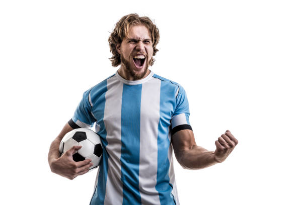 istock Argentinian male athlete / fan celebrating on white background 906508274