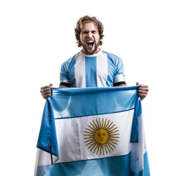 istock Argentinian male athlete / fan celebrating on white background 906509050