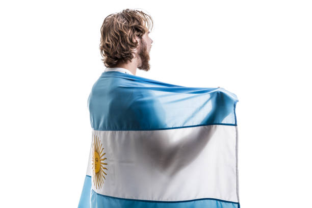 istock Argentinian male athlete / fan celebrating on white background 906509052