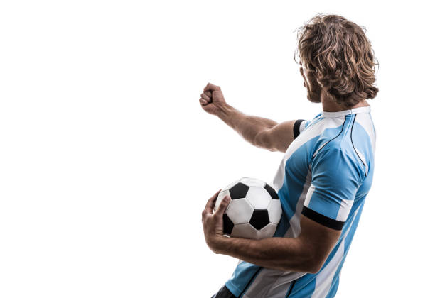 istock Argentinian male athlete / fan celebrating on white background 906509060