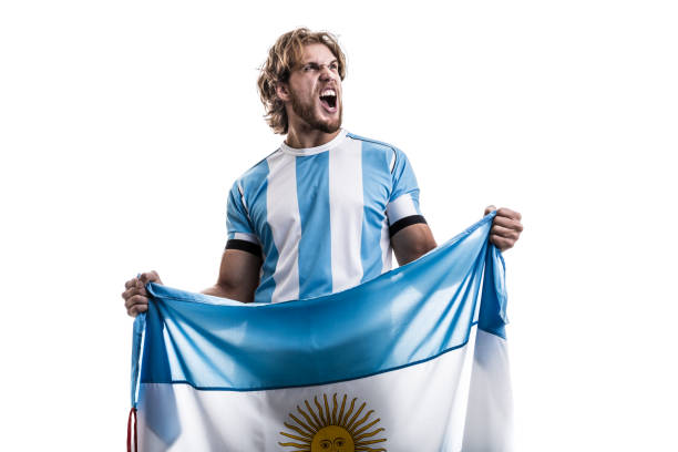 istock Argentinian male athlete / fan celebrating on white background 906509062