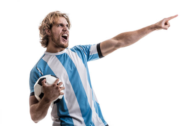 istock Argentinian male athlete / fan celebrating on white background 906509070