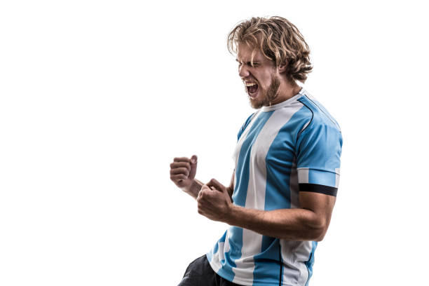 istock Argentinian male athlete / fan celebrating on white background 906509072