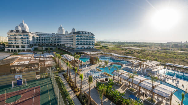 istock Luxury resort hotel with Swimming Pool aerial view 906509188