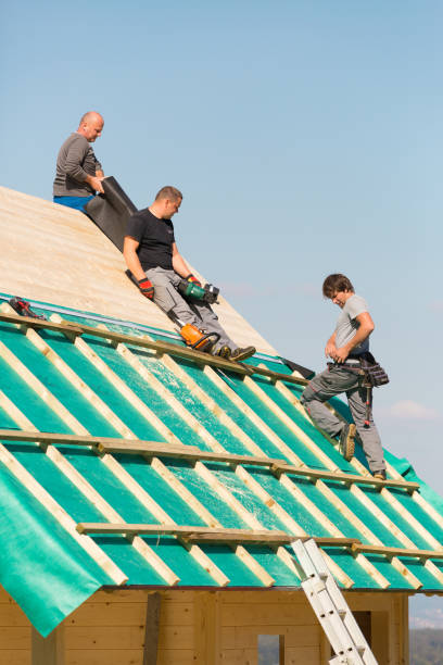 istock Builders at work with wooden roof construction. 906509306