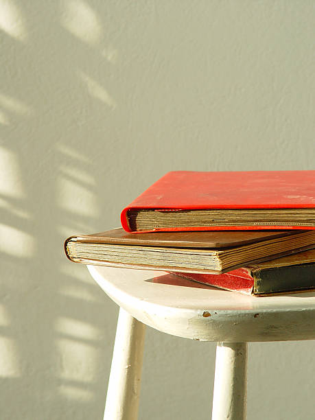 Vintage interior with a table, books and a lamp