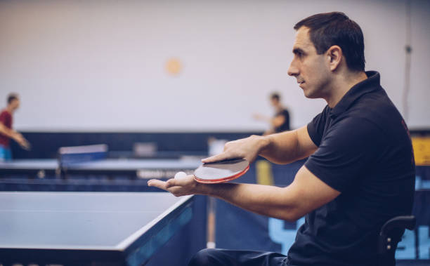 istock Playing table tennis in wheelchair 906509594