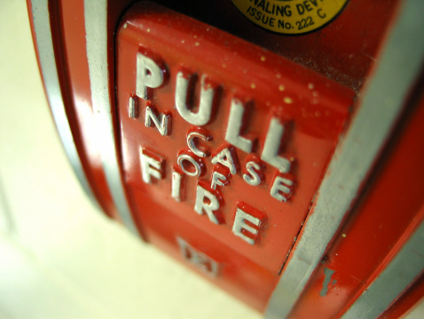 Firefighters using water fire extinguisher to fighting with the fire flame in car accident. Firefighter industrial and public safety concept rescue in night. High quality photo