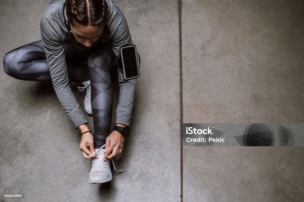 Getting ready Young athlete jogging in underground garage Sport Stock Photo