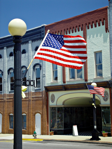 Smaill town main street decorated with American flags
