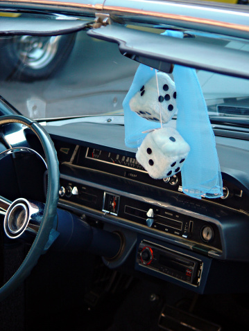 Classic car sporting fuzzy dice