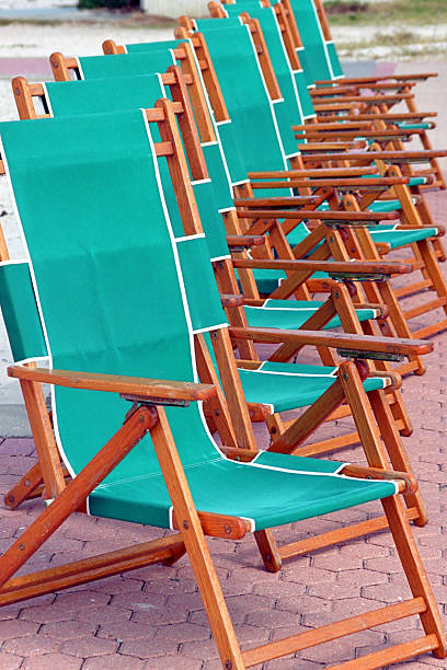 green beach chairs stock photo
