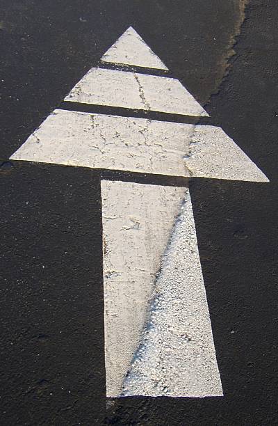istock White Arrow painted on street 90653653