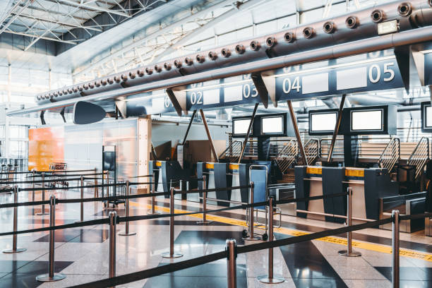 istock Check in area in contemporary airport terminal 906540426