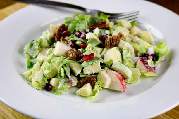 Brussels sprouts, apple and pomegranate with candied pecan salad