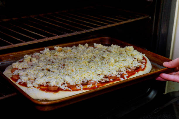 istock Pizza cooking. The pizza baked an oven at a high temperature . 906545436