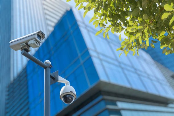 Security camera in front of the office building Building Exterior, Built Structure, Camera - Photographic Equipment, City Street, Equipment pole buildings stock pictures, royalty-free photos & images