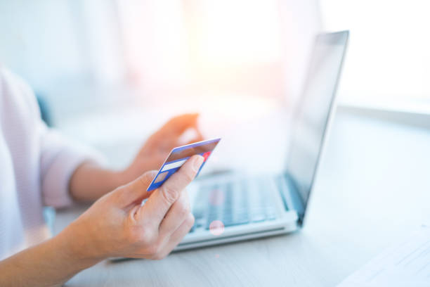 istock Shopping online with laptop computer and credit card 906556760