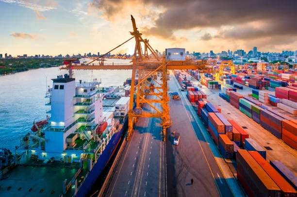 istock Logistics and transportation of Container Cargo ship and Cargo working crane bridge in shipyard 906575738