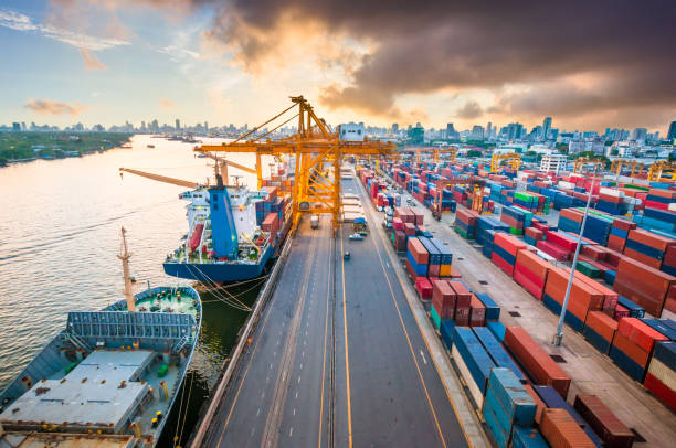 istock Logistics and transportation of Container Cargo ship and Cargo working crane bridge in shipyard 906577828